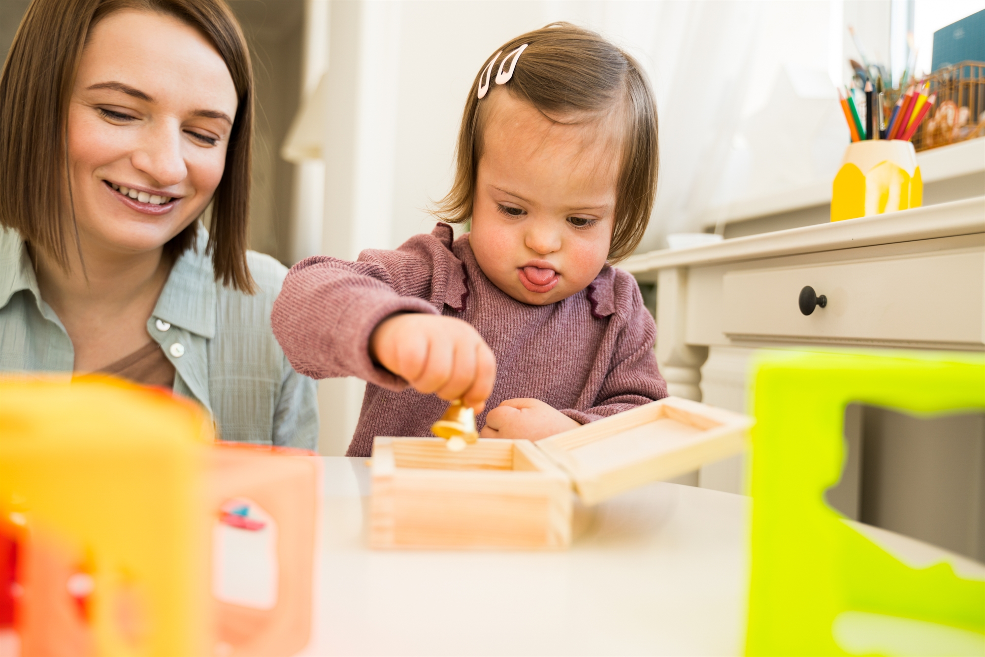 Mom Dad and young girl sitting at a table