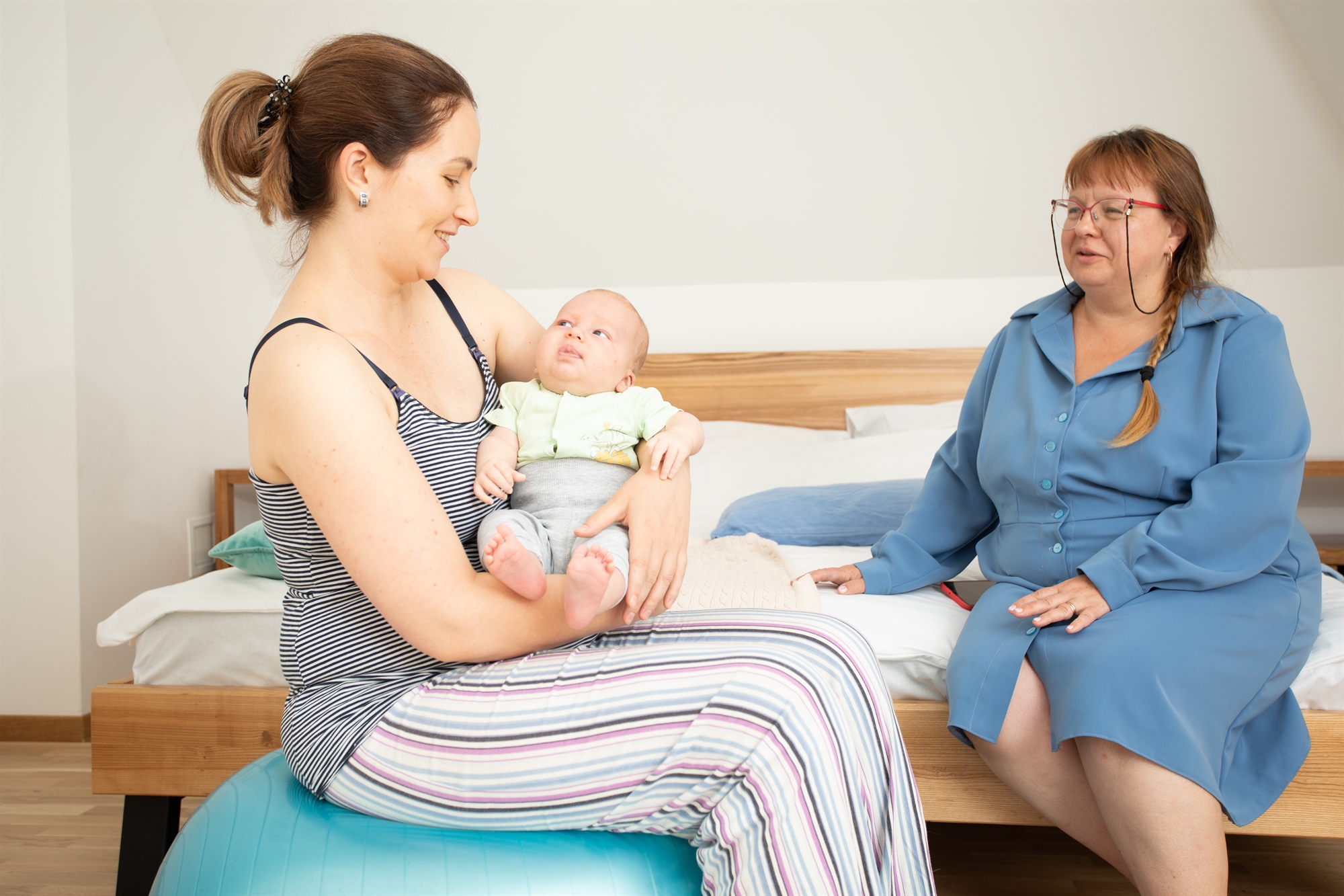 Mom Dad and young girl sitting at a table